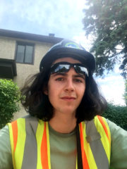 Ben with a safety vest, safety glasses and a hardhat. 