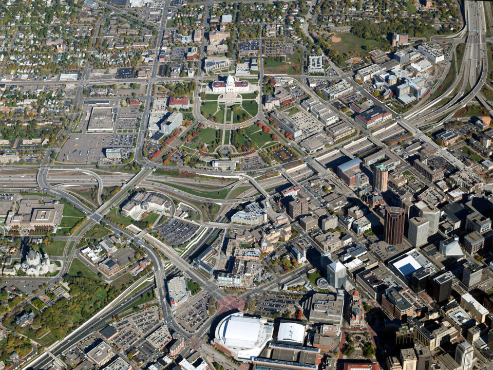 An aerial view of the Capitol Area, the Minnesota State Capitol building and grounds are at the center of the developed, urban area. 